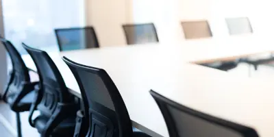 Chairs around a meeting table